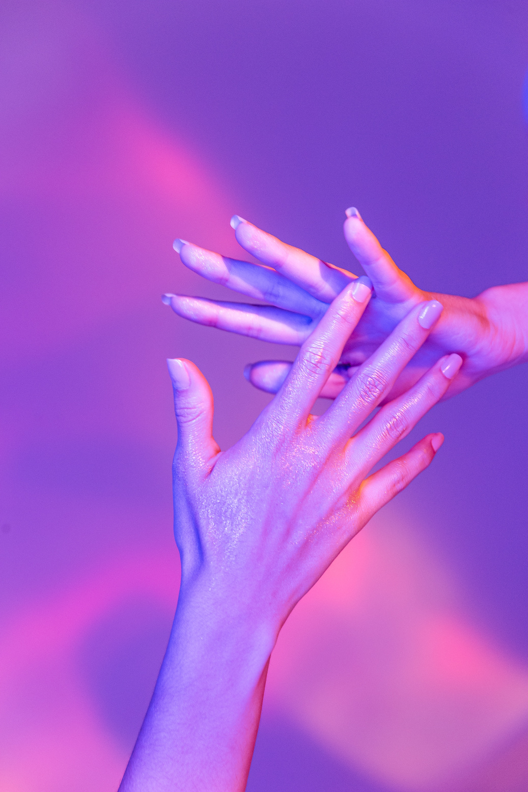 Hands Touching on Neon Lights